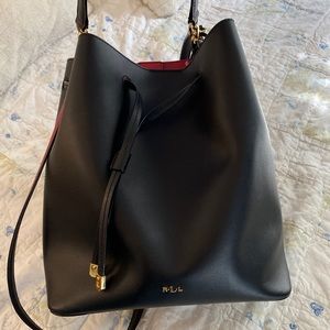 RL black leather bag with red interior.